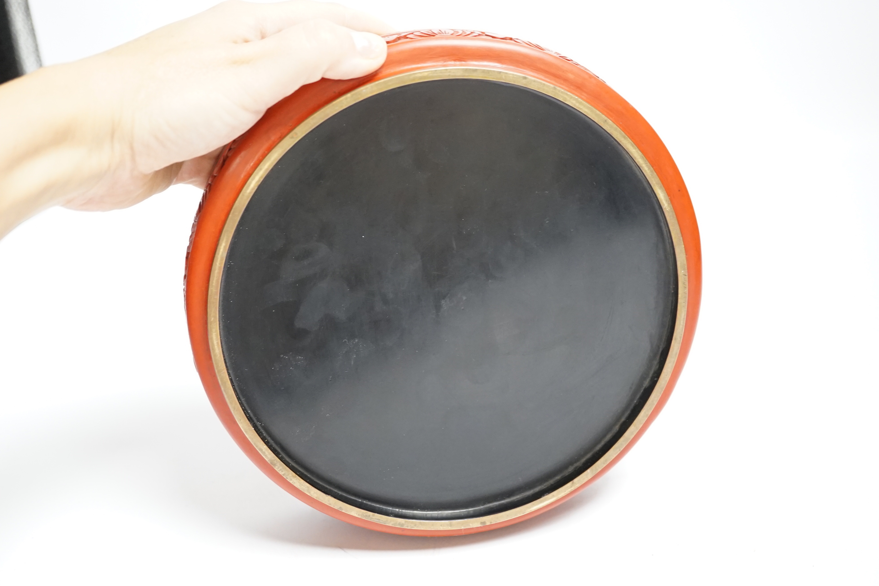 A Chinese cinnabar two colour lacquer box and cover, commemorating 11th Asian Games, Beijing, 20.5cm diameter